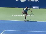 Gael Monfil is finishing his serve on Centre Court at National Bank Open 2023