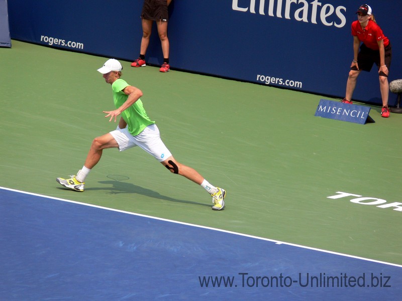 Kevin Anderson (RSA) on the run playing Stan Wawrinka on Centre Court August 7, 2014 Rogers Cup Toronto