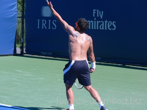 Janko Tipsarevic is stretched to serve on practice, August 6, 2012 Rogers Cup.