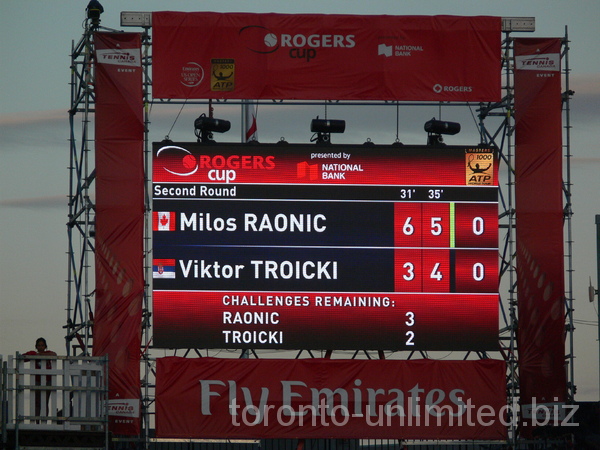 Scoreboard on Central Court showing Raonic won 6 : 3 first set and leading 5 : 4 second set, August 7, 2012 Rogers Cup.