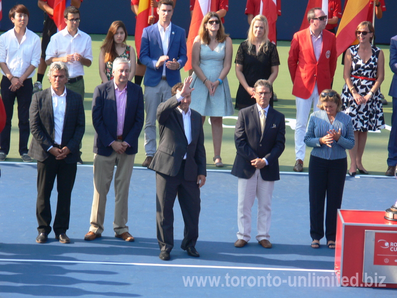 Tennis Canada Organizing Committee, from the left; Karl Hale  Tournament Director, Dale Hooper  Rogers Communication Brand Officer, Ghislain Parent of National Bank with raised hand, Mike Tevlin  Tennis Canada Board of Directors, Giulia Orlandi  WTA Supervisor and Wanda Restivo 40 years as Tennis Volunteer. Rogers Cup Doubles Closing Ceremony 16 August 2015.   