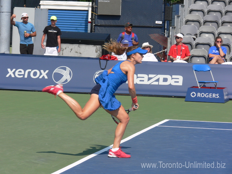Alize Cornet (FRA) serving to Agnieszka Radwanska (POL) on Grandstand Court 13 August 2015 Rogers Cup Toronto