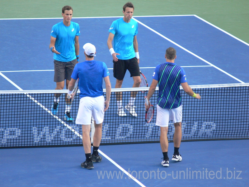 Jamie Murray (GBR) and Bruno Soares (BRA) won the doubles game over Nestor and Pospisil.  Their handshake