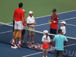 Jumping Milos Raonic during coin-toss with Yen-Hsun LU (TPE) on Centre Court 27 July 2016 Rogers Cup Toronto
