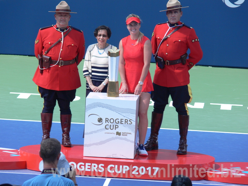 Elina Svitolina with Trophy and Helena Leong and RCMP Honor Guards.