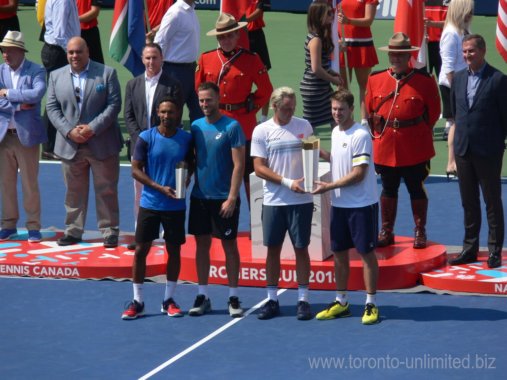 Finalists on the left Raven Klaasen with Michael Venus and Chapions Henri Kontinen and John Peers with their Trophies. Rogers Cup 2018 Toronto