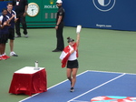 Happy Champion wrapped in Canadian flag and displaying Championship Trophy, August 11, 2019 Rogers Cup Toronto
