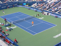 Boris Becker and Daniel Nestor playing exhibition match.