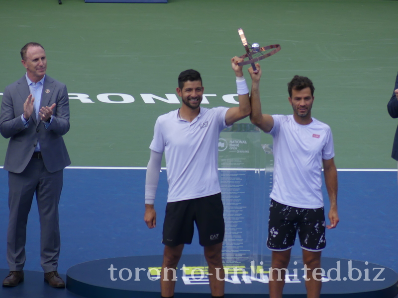 Champions Marcelo AREVALO and Jean-Julien ROJER lifting their Trophy