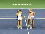 The players are embracing each other and  Caroline Dolehide (USA), Desirae Krawczyk (USA) are the winners